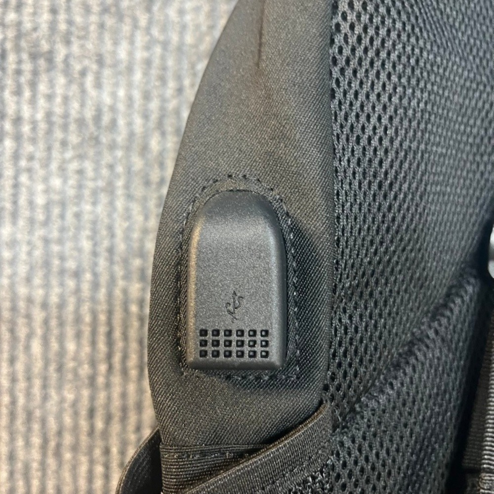Black Sling Backpack Crossbody Shoulder Bag with Bungee Cord and Headphone Port - Picture 6 of 7